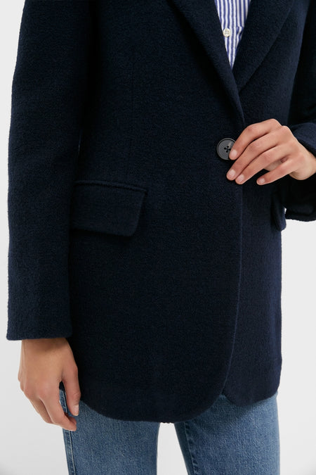 Navy Boucle Leo Blazer, a classic with peak lapels and oversized fit, over a striped shirt, exuding effortless high-end style with a fun, modern twist.