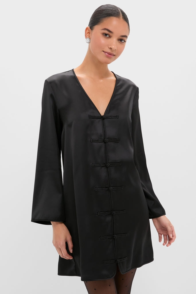 Black Satin Tatiana Dress, featuring a classic V-neck and chic frog closures, offers an effortless, high-end look perfect for fun day-to-night occasions.