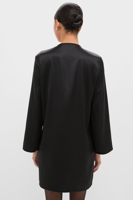 Back view of the Black Satin Tatiana Dress, highlighting its classic, effortless style with long sleeves and chic detailing, perfect for high-end, fun occasions.