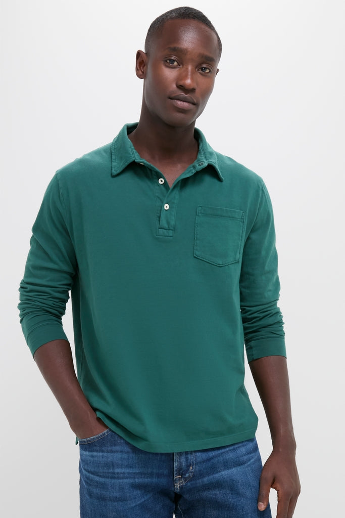Young man wearing the classic Washed Pine Long Sleeve Hudson Polo and jeans, embodying effortless style and high-end comfort with a fun, versatile look.