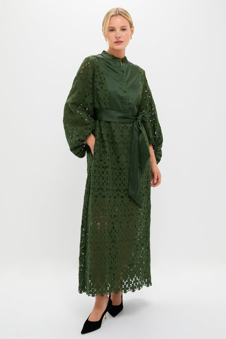 Model wearing the classic Forest Green Lace Calliope Dress, featuring a mandarin collar, buttoned bodice, and scalloped lace skirt, paired with black heels for an effortless, high-end look.
