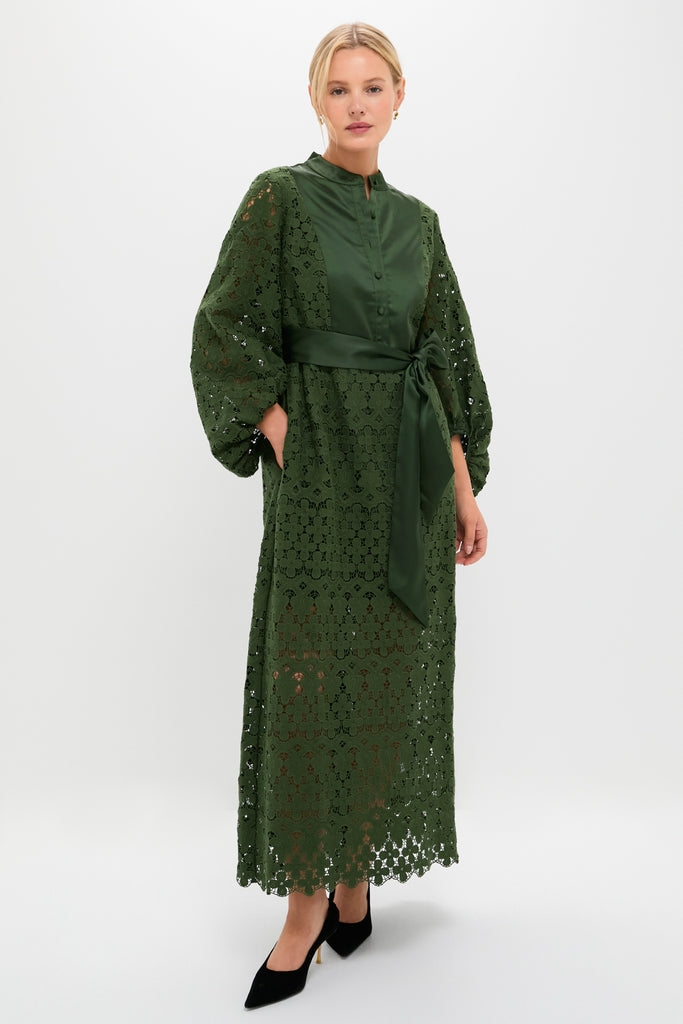 Model wearing the classic Forest Green Lace Calliope Dress, featuring a mandarin collar, buttoned bodice, and scalloped lace skirt, paired with black heels for an effortless, high-end look.