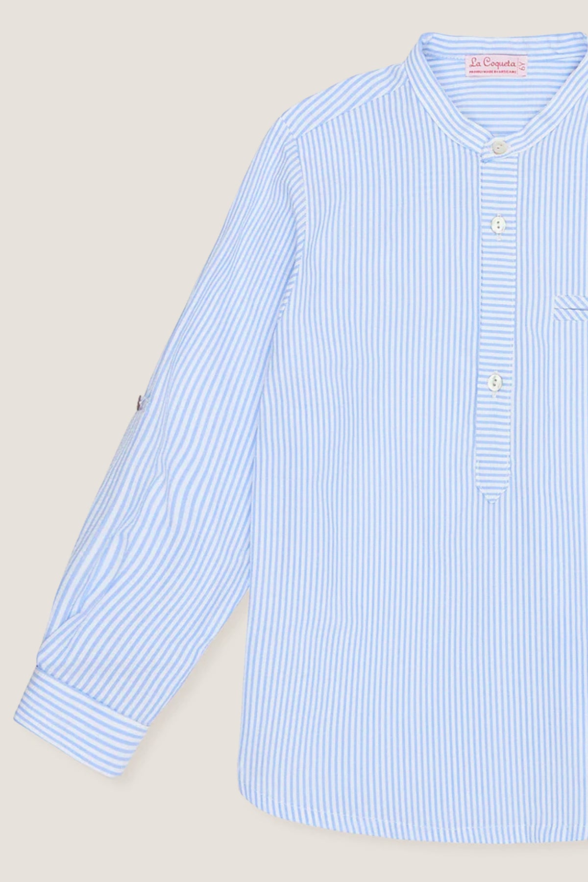 Blue Stripe Mateo Long Sleeve Shirt with a mandarin collar, classic chest pocket, and button-tab sleeves, offering an effortless, high-end look for fun, smart-casual occasions.