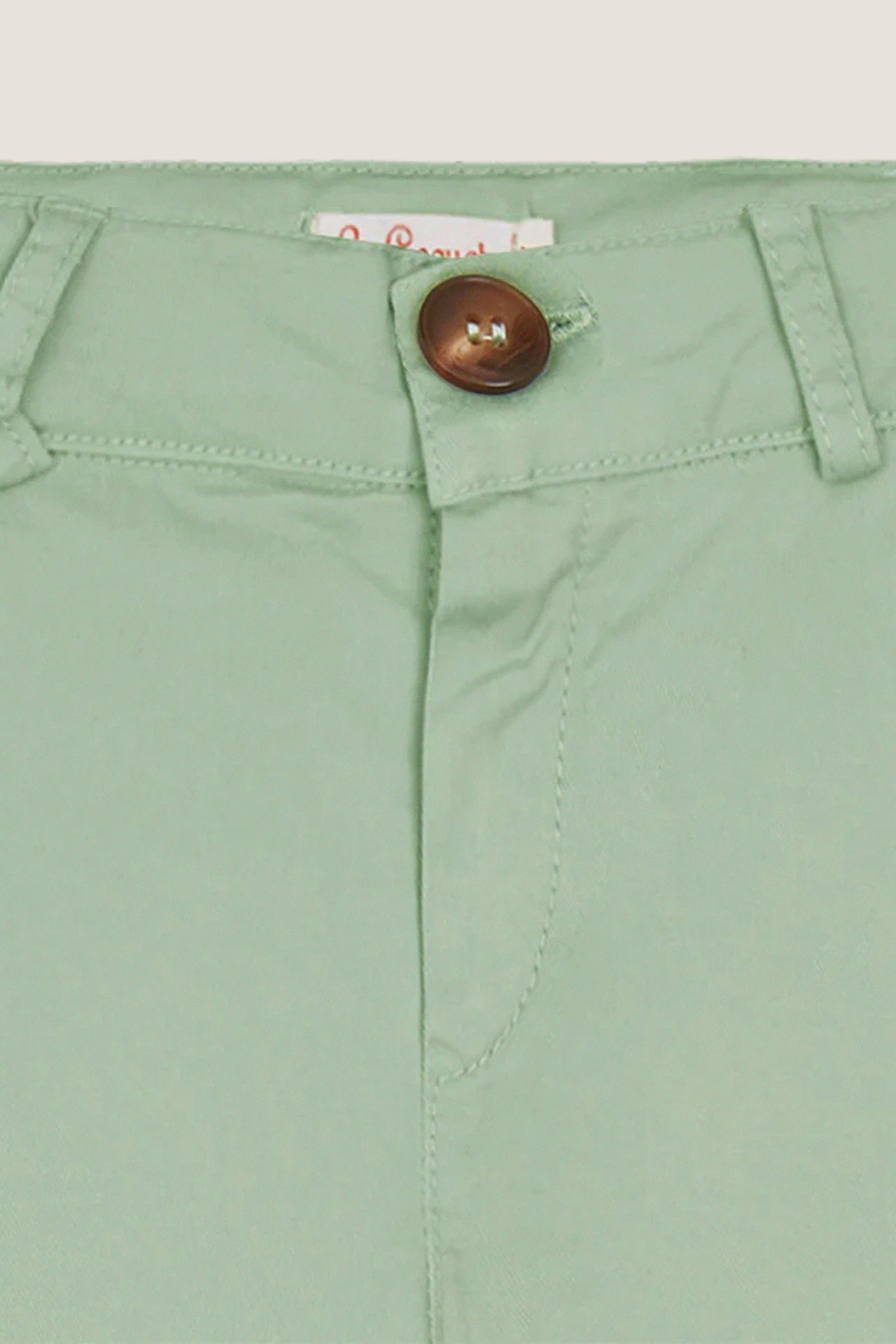 Close-up of Sage Green Elio Chinos waistband, showcasing classic button closure, belt loops, and tailored details for an effortless, high-end, and fun look.