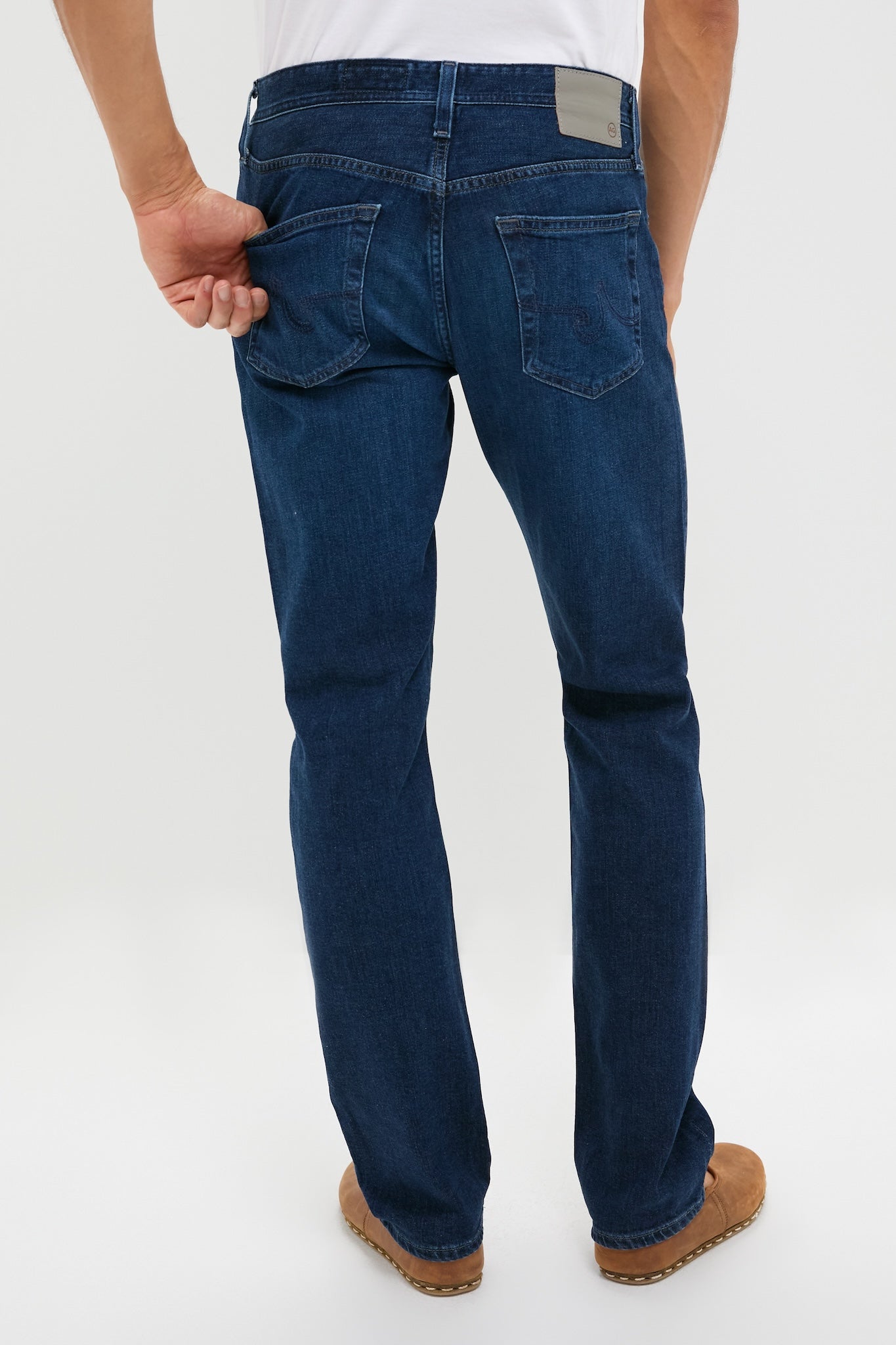 The Graduate in Crusade Wash Denim (32 Inseam) showcases a classic, effortless style with a relaxed fit, highlighted by a sleek back pocket detail. Perfect for fun, high-end fashion.
