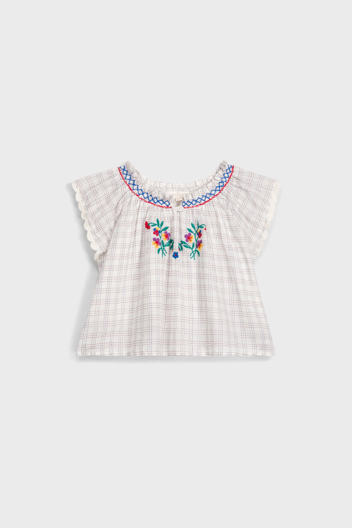 Cream Cruise Checks Perlane Blouse: Classic, airy cotton top with flutter sleeves, scalloped edges, and vibrant floral embroidery. An effortless, fun, high-end piece for your little one's wardrobe.