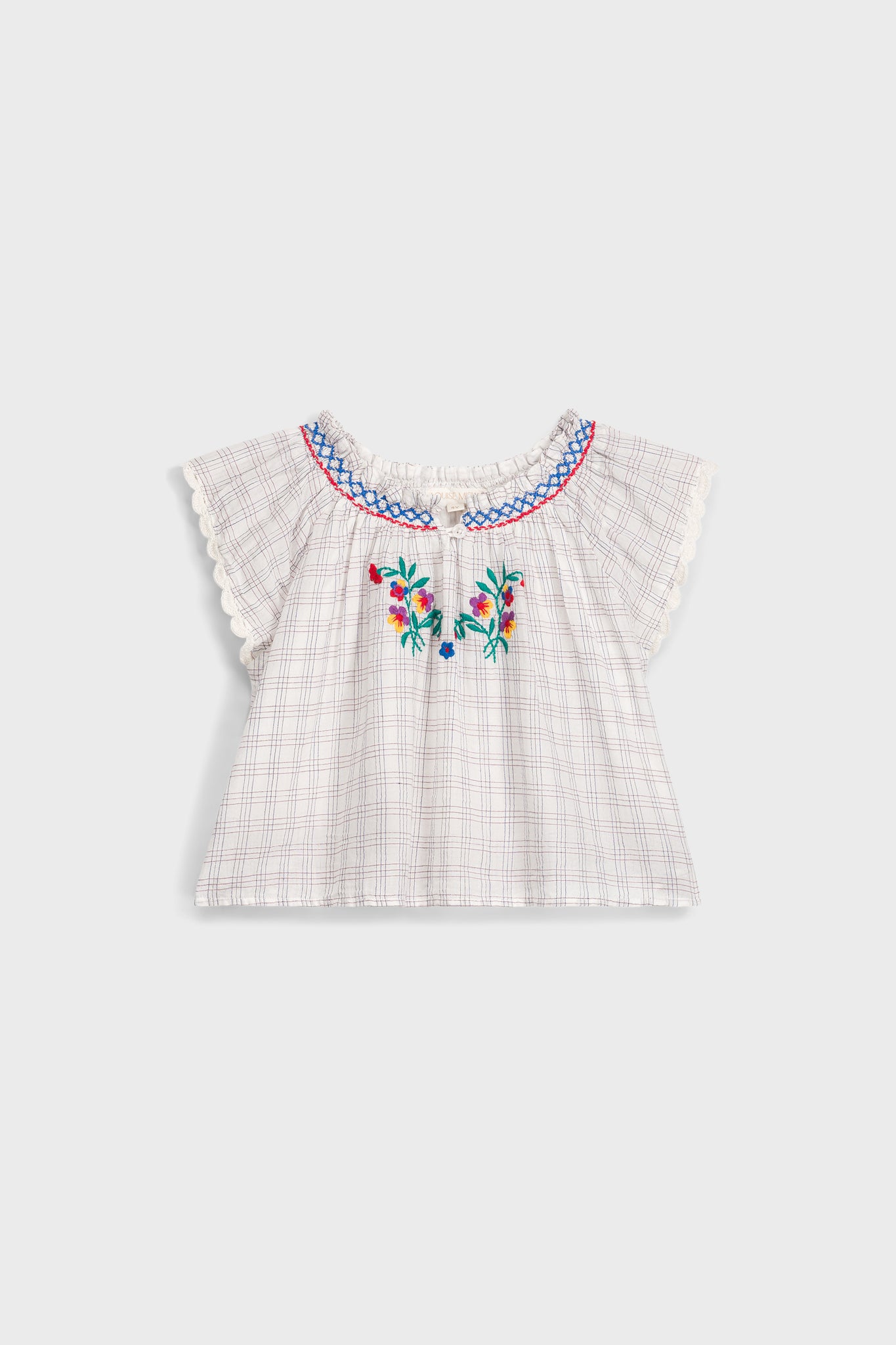 Cream Cruise Checks Perlane Blouse: Classic, airy cotton top with flutter sleeves, scalloped edges, and vibrant floral embroidery. An effortless, fun, high-end piece for your little one's wardrobe.
