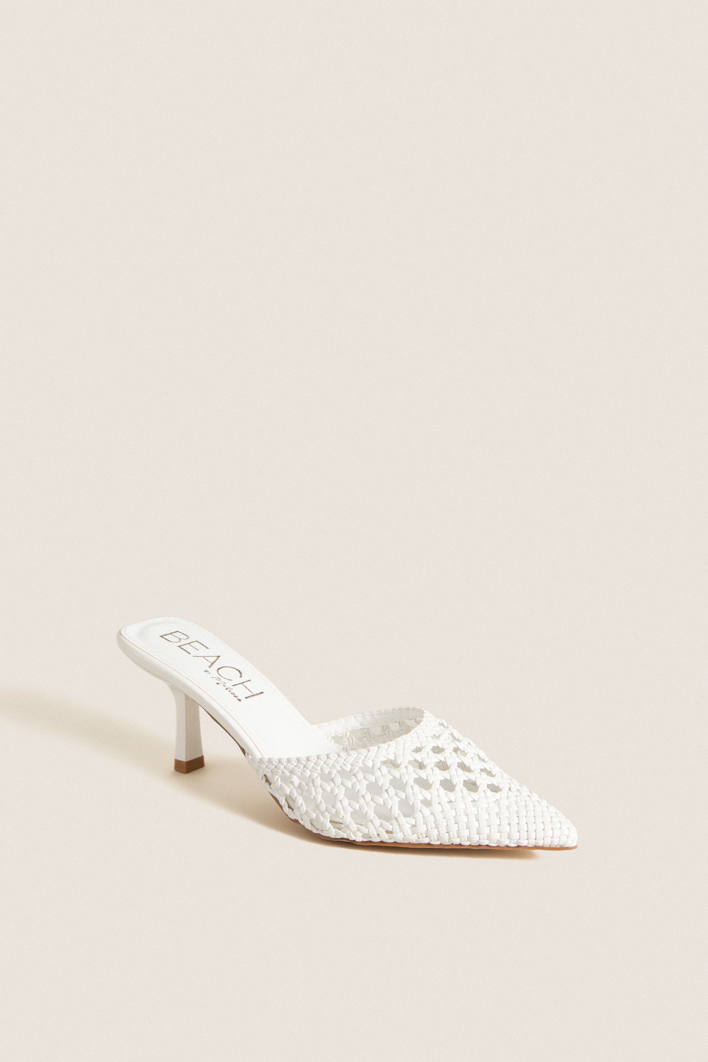 White Tia Heels: Classic, high-end mule with a woven, pointed-toe design and comfortable kitten heel, embodying effortless style for fun, versatile fashion.