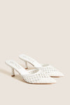 White Tia Heels: Classic pointed-toe, woven mule with kitten heel, offering effortless style for fun occasions or high-end everyday wear. Ideal for versatile, polished looks.