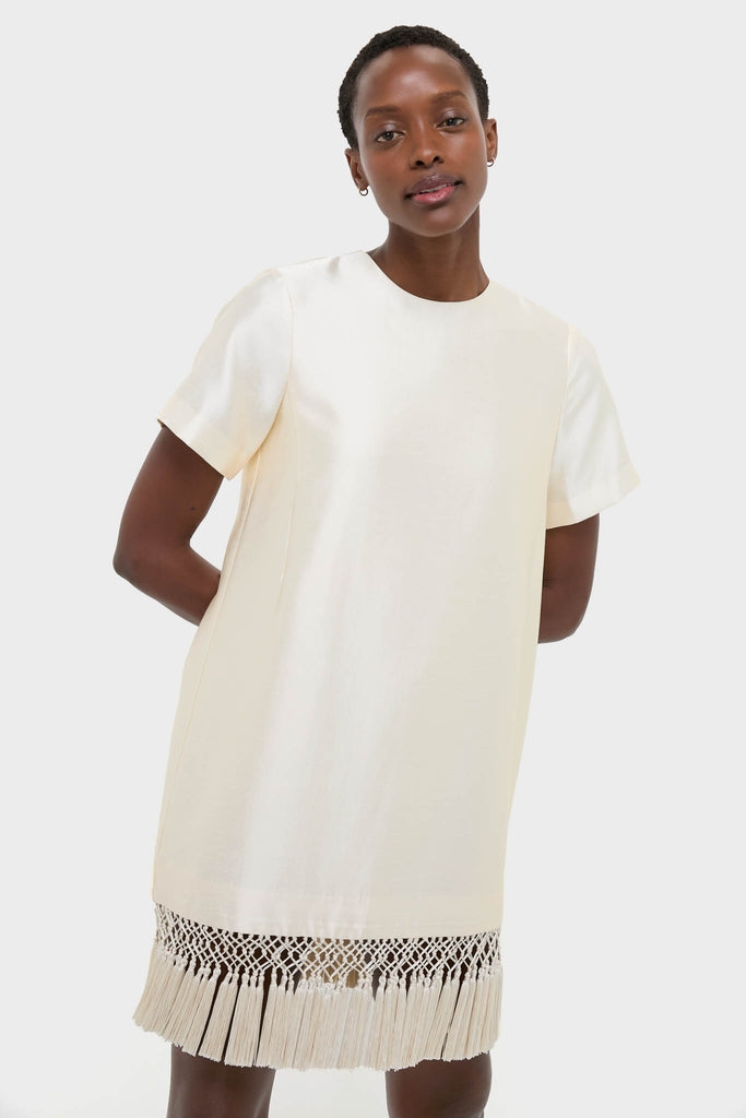 Winter White Tassel Dupioni Downing Dress: A classic, effortless shift dress with a fun fringe hem, perfect for high-end holiday gatherings or dancing nights.