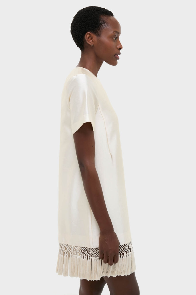 Winter White Tassel Dupioni Downing Dress: A classic, effortless shift dress with tassel fringe hem, perfect for a high-end, fun holiday look.