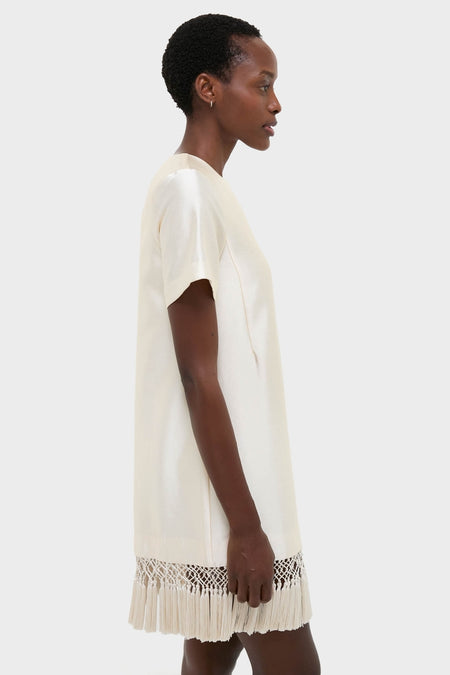 Winter White Tassel Dupioni Downing Dress: A classic, effortless shift dress with tassel fringe hem, perfect for a high-end, fun holiday look.