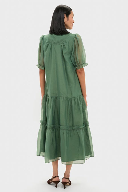 Green Chiffon Selena Maxi Dress with classic tiered ruffles and puff sleeves, exudes effortless elegance; perfect for fun, high-end cocktail parties.