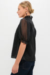Black Chiffon Selena Blouse: Classic and effortless with sheer puff sleeves, ruffled collar, and textured sheen, offering a fun, high-end style for versatile dressing.