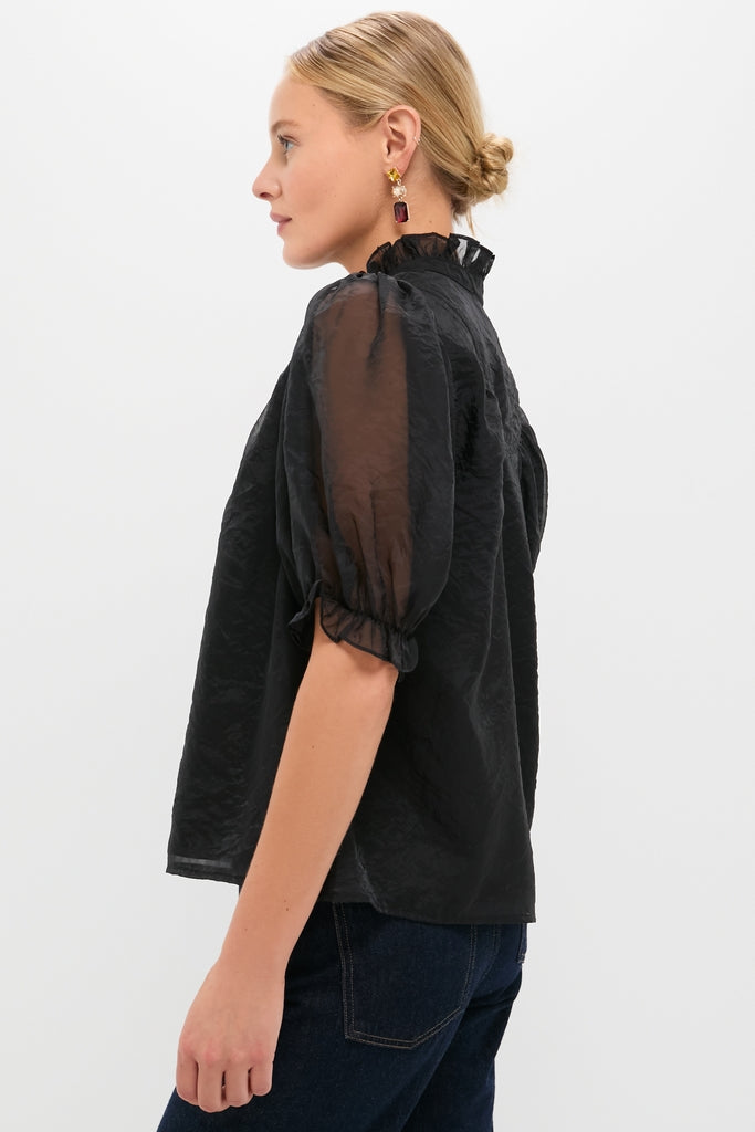 Black Chiffon Selena Blouse: Classic and effortless with sheer puff sleeves, ruffled collar, and textured sheen, offering a fun, high-end style for versatile dressing.