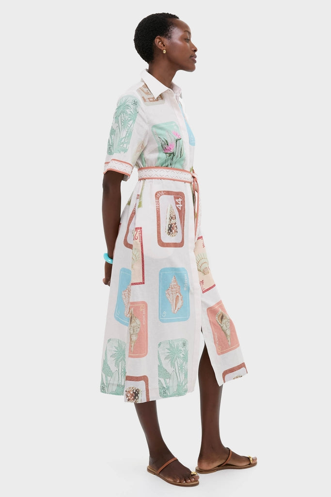 Coastline Shirt Dress: A classic, effortless midi-length dress with pastel seashell and foliage print, cinched waist, perfect for a fun, high-end look.