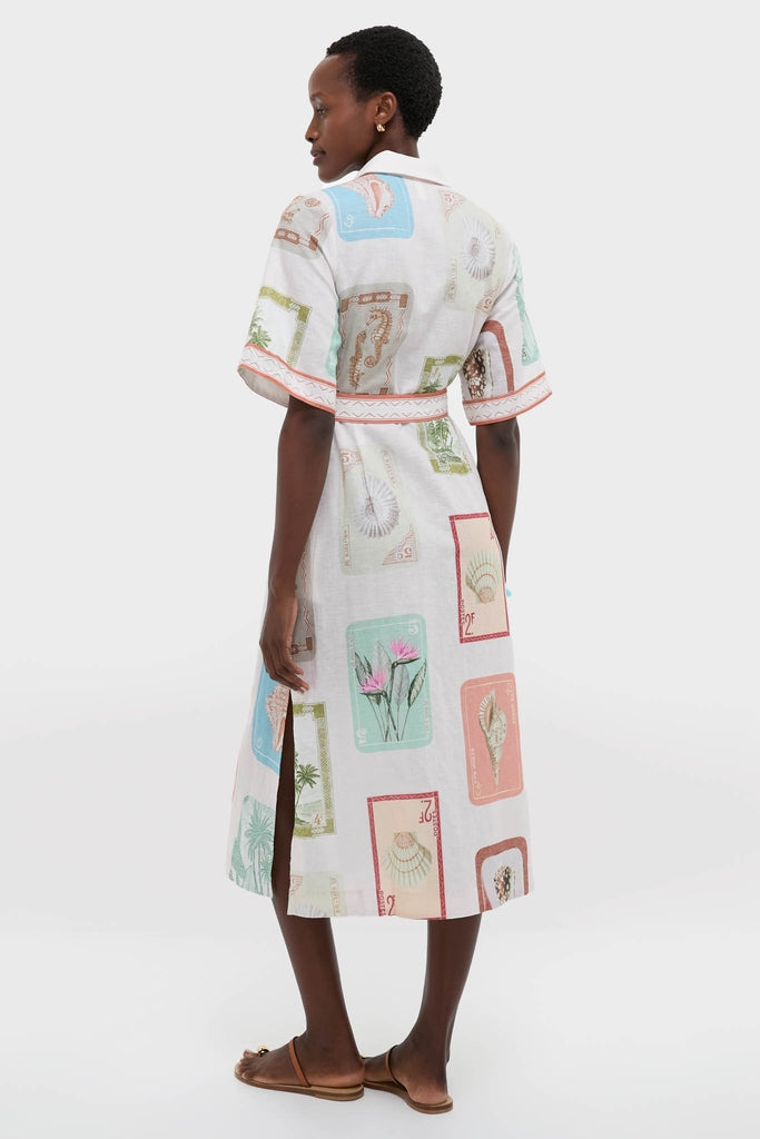 Coastline Shirt Dress: A classic, effortless midi shirt dress with postage-stamp motifs, elbow sleeves, and a waist belt, embodying fun, high-end style.