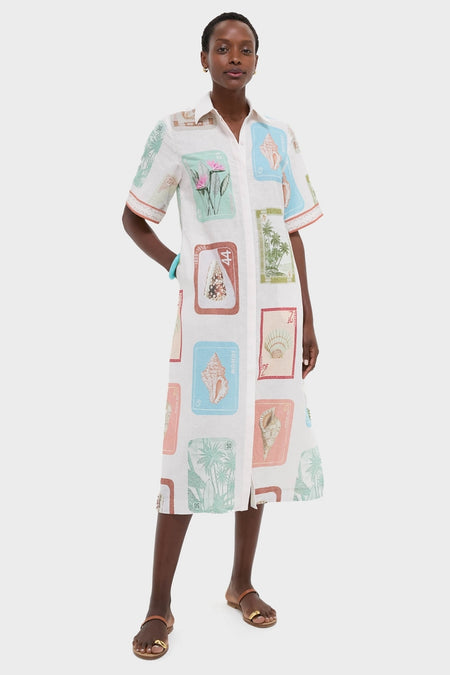 Coastline Shirt Dress: A classic, effortless midi shirt-dress with seaside stamp motifs, side seam pockets, and a front slit, paired with fun, high-end sandals.