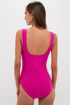 Woman wearing the classic Berry Dreamsculpt Square Neck Tank One Piece swimsuit in fuchsia-pink, showcasing effortless elegance and fun, high-end design with luxury French fabric.