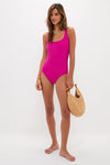 Effortless classic elegance: The Berry Dreamsculpt Square Neck Tank One Piece swimsuit, featuring a playful, high-end design, paired with a fun woven straw handbag.