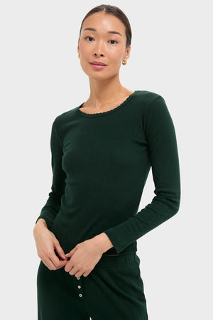 Model wearing Forest Pointelle Slim Fit Long Sleeve Tee with matching bottoms; classic, effortless style featuring scalloped edges and eyelet details, capturing a high-end, fun aesthetic.
