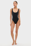 Black Mona Scoop Neck One Piece with silver hardware and high-cut legs, exuding classic, effortless style and fun, high-end appeal.
