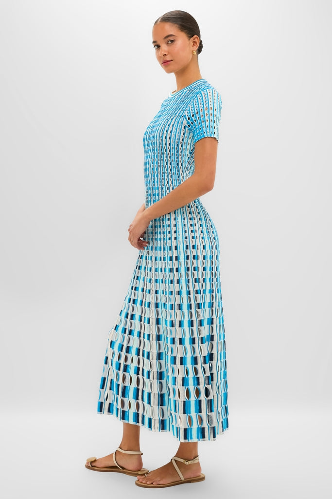 Azure Multi Zaida Midi Dress: Classic and effortless knit dress with a geometric pattern, A-line silhouette, styled with neutral sandals for a high-end, fun look.