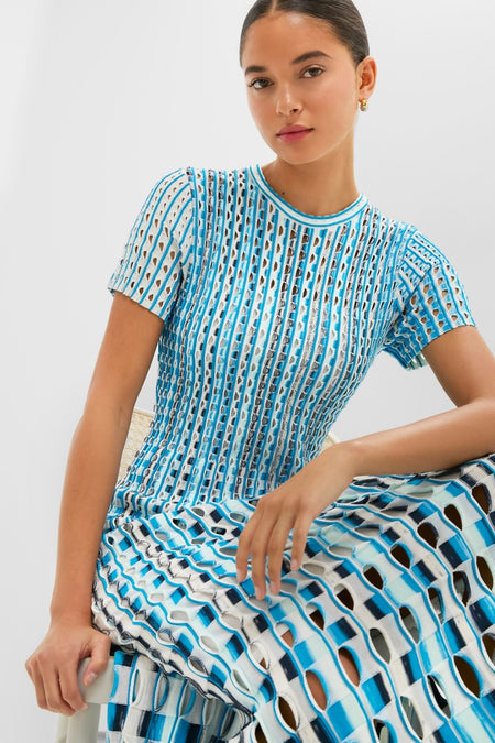 Azure Multi Zaida Midi Dress: Model in a classic, effortless two-piece with geometric knit pattern, showcasing fun, high-end style by SIMKHAI.