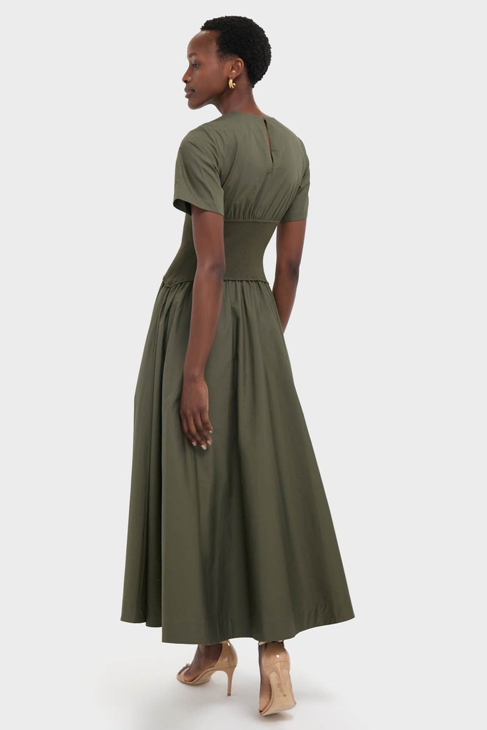 Fern Wrenna Short Sleeve Midi Dress exudes effortless elegance with its classic, full-skirt design and gathered waist, paired stylishly with nude high-heeled sandals.