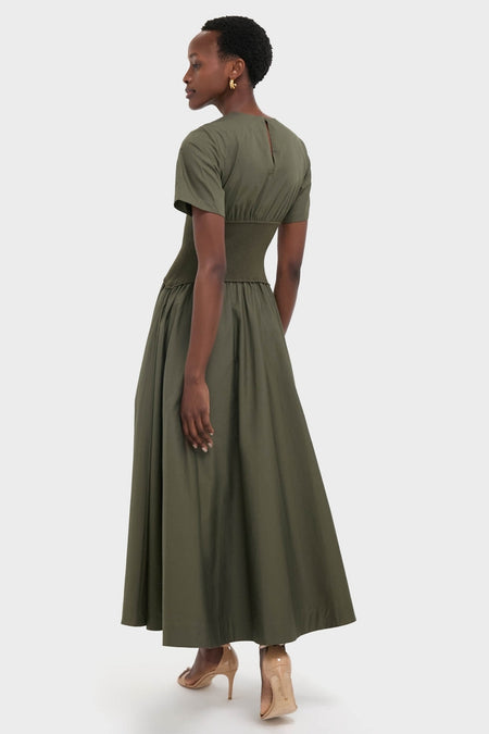 Fern Wrenna Short Sleeve Midi Dress exudes effortless elegance with its classic, full-skirt design and gathered waist, paired stylishly with nude high-heeled sandals.