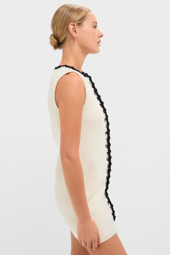 White Knit Lalia Mini Dress: A classic and effortless crochet-knit mini with black trim, perfect for fun, high-end vacation style.
