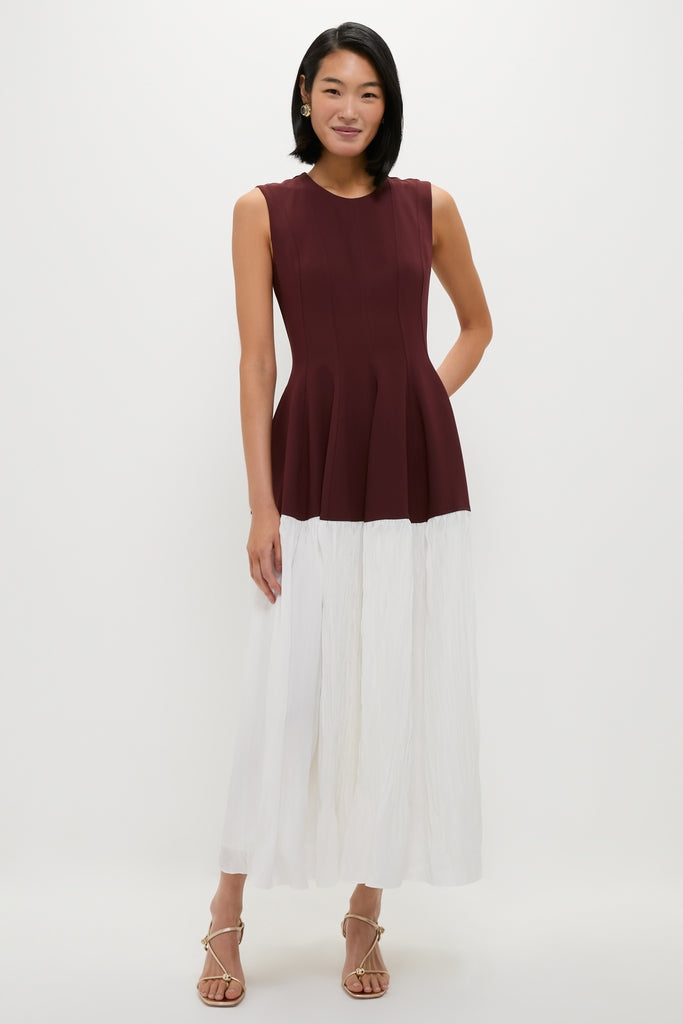 Model wears Mahogany Multi Raleigh Midi Dress, featuring a classic fitted bodice and flowing skirt, paired with gold-tone sandals for an effortless, high-end look.