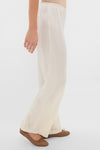 Classic and effortless, the Creme Barb Wide Leg Pants offer a high-end look with a relaxed fit and elastic waistband, styled with brown ballet flats.
