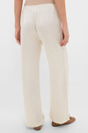 Back view of Creme Barb Wide Leg Pants, featuring a classic, effortless silhouette with an elastic waistband and silky finish. Perfect for fun, high-end everyday elegance.