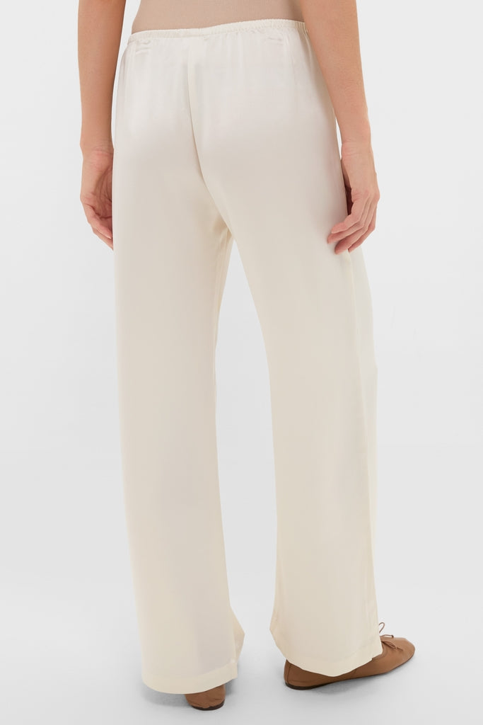 Back view of Creme Barb Wide Leg Pants, featuring a classic, effortless silhouette with an elastic waistband and silky finish. Perfect for fun, high-end everyday elegance.