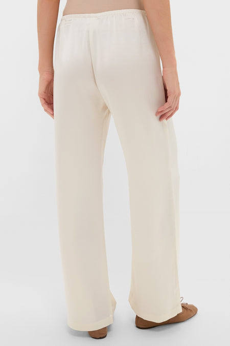 Back view of Creme Barb Wide Leg Pants, featuring a classic, effortless silhouette with an elastic waistband and silky finish. Perfect for fun, high-end everyday elegance.