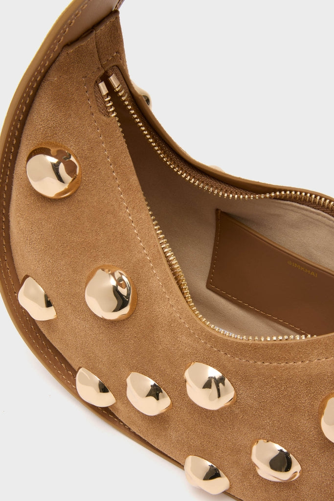 Camel Finn Studded Suede Shoulder Bag—classic crescent design with gold studs, effortless tan suede, fun and high-end interior, perfect for confident style.