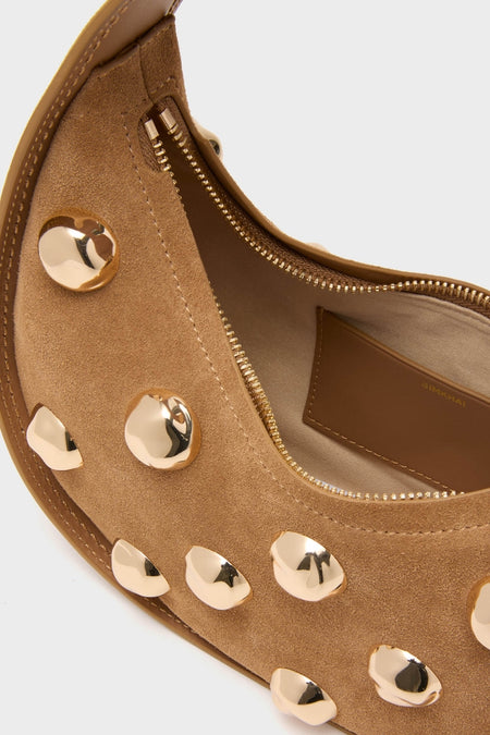 Camel Finn Studded Suede Shoulder Bag—classic crescent design with gold studs, effortless tan suede, fun and high-end interior, perfect for confident style.