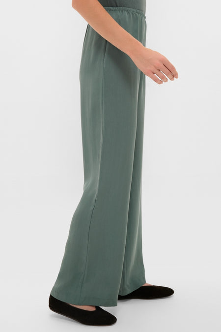 Eucalyptus Kim Pocket Pants: Classic, effortless wide-leg pants with an elastic waistband, modeled with black slip-on flats for a fun, high-end look.