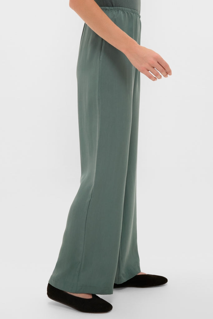 Eucalyptus Kim Pocket Pants: Classic, effortless wide-leg pants with an elastic waistband, modeled with black slip-on flats for a fun, high-end look.