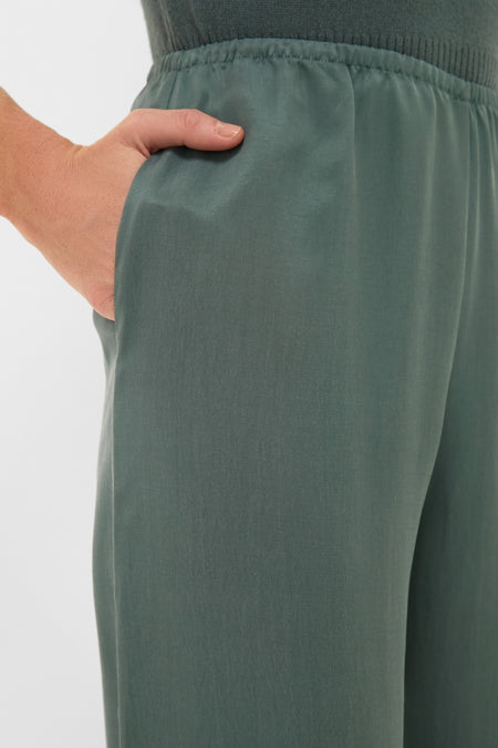 Eucalyptus Kim Pocket Pants showcase classic, high-waisted wide-leg design with an elastic waistband and side pockets, embodying Tuckernuck's effortless, fun, high-end style.
