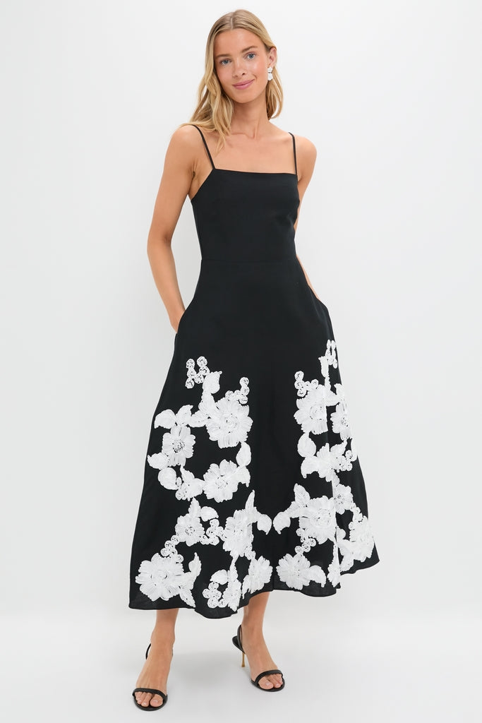 Black Multi Annabella Midi Dress: classic and effortless with floral applique, square neckline, and adjustable straps, embodying a high-end, fun style with pockets and a flattering silhouette.