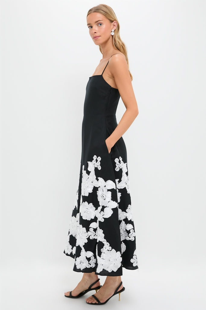 Black Multi Annabella Midi Dress: A classic, high-end sundress with effortless flair, featuring delicate floral embroidery, adjustable spaghetti straps, and a fun, feminine silhouette.