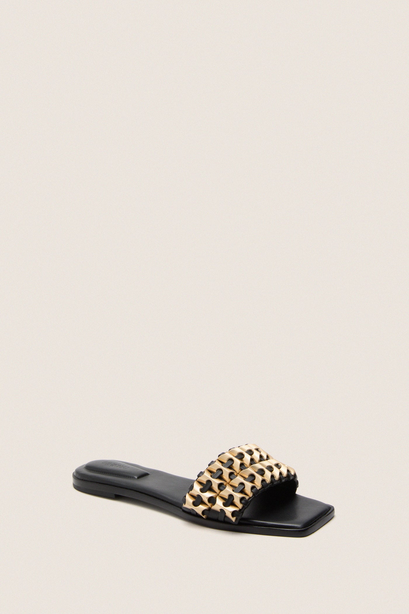 Black Faye Beaded Leather Flat Slides featuring a classic slip-on design with gold-tone woven strap, embodying effortless elegance and high-end style for a fun, versatile look.