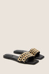 Black Faye Beaded Leather Flat Slides with a classic slip-on design, featuring a woven lattice strap with gold-tone beading. Effortless and high-end, perfect for fun outings.