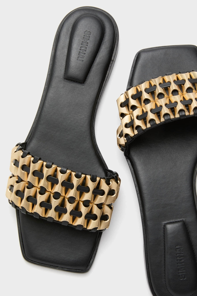 Black Faye Beaded Leather Flat Slides featuring a wide strap with interlocking gold-tone chain detail, offering a classic and effortless high-end appeal.