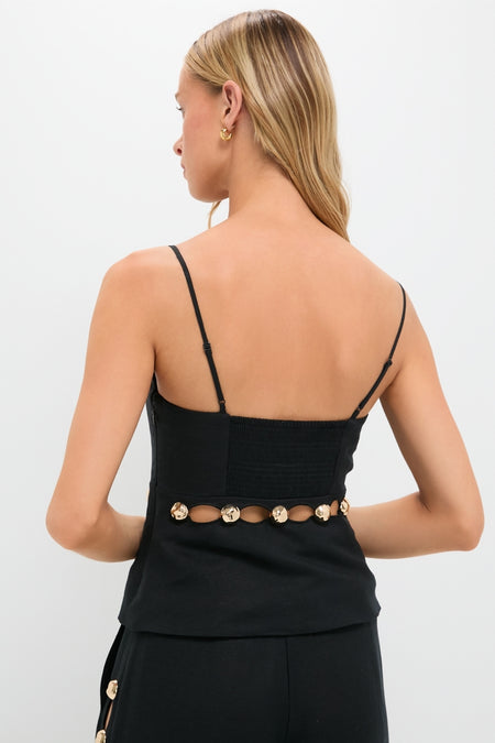 Model in Black Cruz Cami, classic and effortless with gold-disc waist accents, showcasing a high-end, fun look. Perfectly paired with matching bottoms for a polished finish.