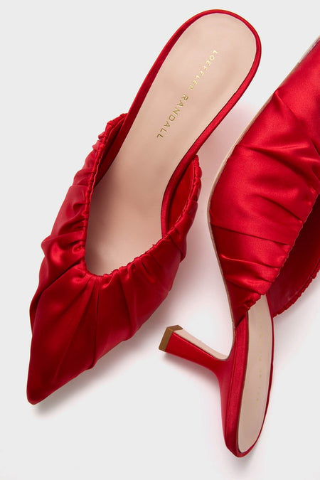 Red Satin Inez Heels: Classic slip-on mules with a pointed toe, gathered upper, and slim mid-height heel, embodying effortless style and high-end fashion.