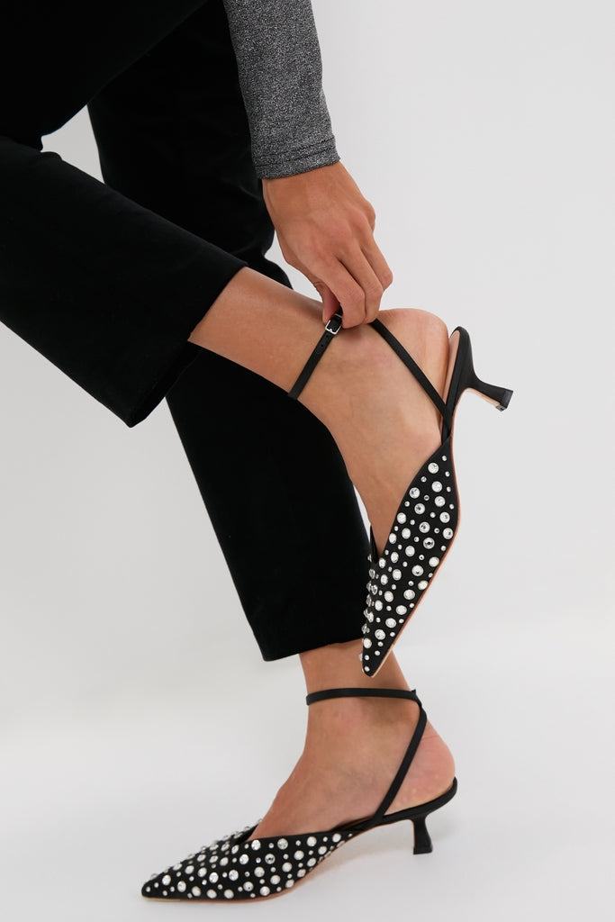 Classic Black Satin with Crystal Rio Heels, featuring pointed toes and slingback kitten heels, effortlessly fastened with adjustable ankle straps for a high-end, fun look.