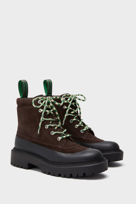 Tmoro Remy Boots: Classic dark brown suede lace-up ankle boots with chunky lug soles and fun green-patterned laces, offering an effortless, high-end style for everyday wear.